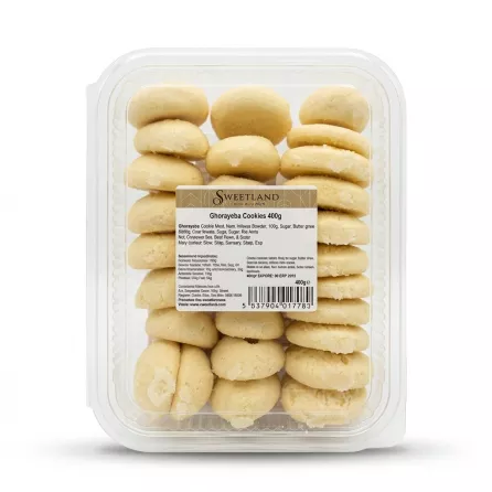 A professional e-commerce photo of a clear plastic container filled with Sweetland Ghorayeba Cookies Classic, 400g. The container is centered against a clean white background, showing the stacked, pale yellow cookies. The main product label is visible and clear, while all other tags and stickers have been removed. PRODUCT TITLE: Sweetland Ghorayeba Cookies Classic PRODUCT: Sweetland Ghorayeba Cookies 400g clear pack with label