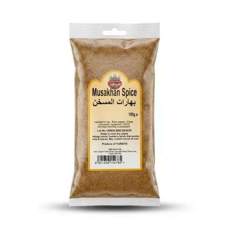 Enhanced Safa Musakhan Spice 100g packet held in hand in a grocery aisle