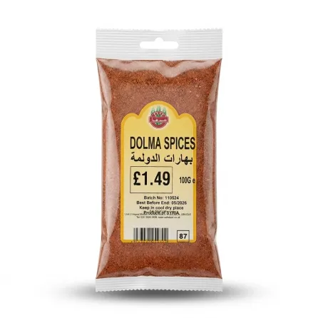 Enhanced Hand holding a 100g pack of Safe Dolma Spices with clear packaging and visible price label