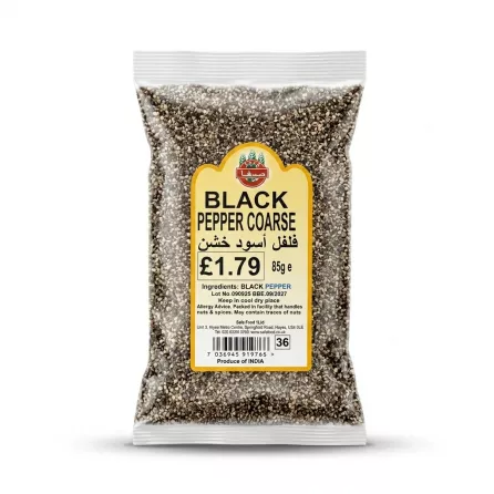 Enhanced A hand holding an 85g pack of Safa Black Pepper Coarse with price and product details visible