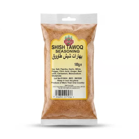 Enhanced Safa Food Shish Tawoq Seasoning 100g packet held in hand in a grocery store