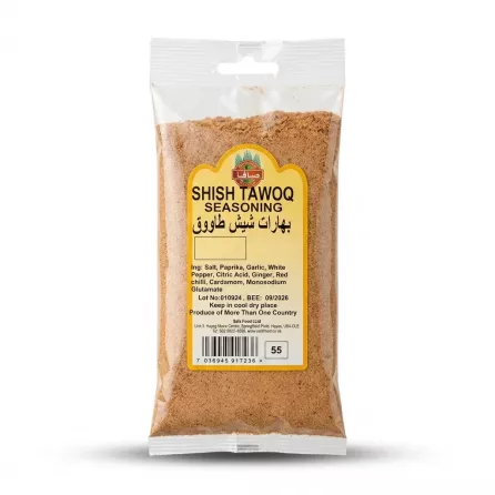 Enhanced A 100g packet of Safa Shish Tawoq Seasoning held in hand in a grocery store