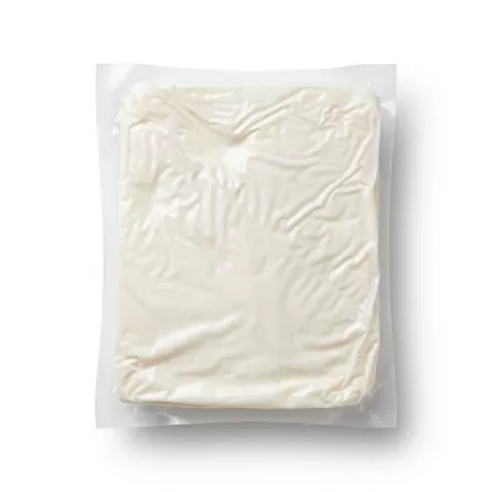 Enhanced Vacuum-sealed block of white brined sheep's milk cheese