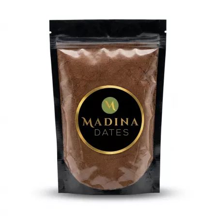 Enhanced A resealable pouch of Madina Dates date powder held in hand
