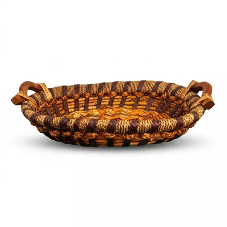 Enhanced Side view of a rustic oval wicker basket with brown and golden weaving