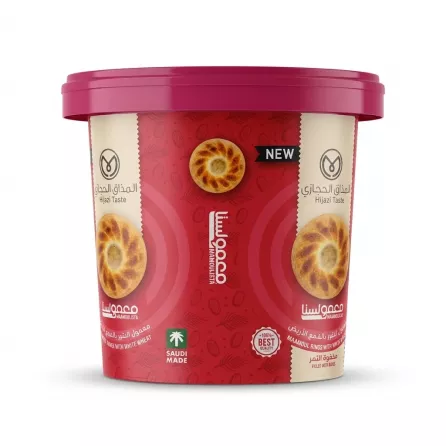 A professional e-commerce product photo of the Hijazi Taste Maamoulista Maamoul Rings white wheat tub, featuring a vivid red and pink label with illustrations of the traditional date-filled cookies, centered against a clean white background with soft, symmetrical shadows. PRODUCT TITLE: Hijazi Taste Maamoul Rings - Halal Dates Delight PRODUCT: Hijazi Taste Maamoulista Maamoul Rings with white wheat tub front view