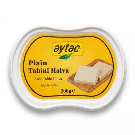 A professional 300g tub of Aytac Plain Tahini Halva, presented in a clean, professional studio photograph. The yellow and white label features the product title in English, Turkish (Sade Tahin Helva), and Arabic (حلاوة الطحينية), along with an illustration of halva pieces on a wooden board. The product is centered on a seamless white background with soft, even lighting and a gentle shadow.
