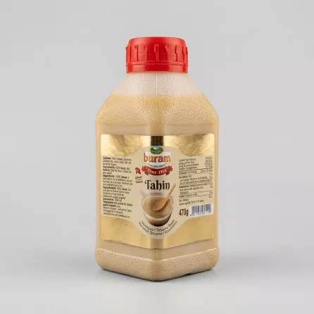 Enhanced Buram Tahin Sesame Paste 470g bottle held in hand with special offer label