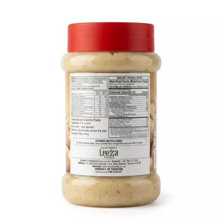 A professional, clear close-up photograph of the back of a plastic jar containing Leeza Foods Ginger & Garlic Paste. The red lid is at the top, and the jar fills 85% of the frame. The central label is perfectly clean, displaying the detailed nutritional facts table in English, French, and Arabic, storage instructions, and contact details for Leeza Foods. The product rests on a clean white surface with professional lighting and soft, equal shadows.