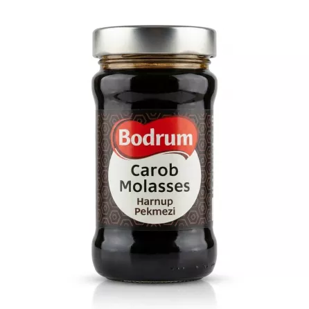 Enhanced Front of Bodrum Carob Molasses jar held in hand
