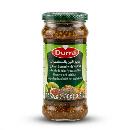 Enhanced Hand holding a jar of Durra Fig Fruit Spread with Walnut 430g