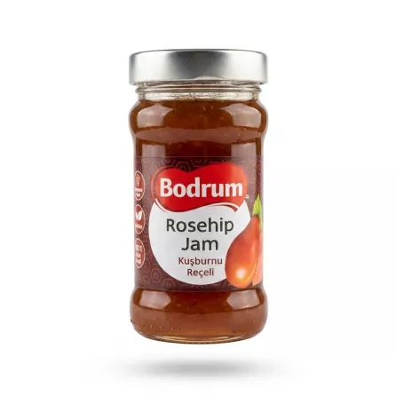 A clear glass jar of Bodrum Rosehip Jam Spread with a silver lid is presented in a professional studio setting against a clean white background.