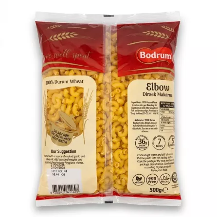 A clear, professional back-of-package view of a 500g bag of Bodrum Elbow Dirsek Makarna pasta, displaying detailed text, nutritional information, icons, a barcode, and the clear window showing the pasta shapes against a pure white background. PRODUCT TITLE: Bodrum Elbow Dirsek Makarna Pasta PRODUCT: Back of Bodrum Elbow Dirsek Makarna pasta showing ingredients and instructions
