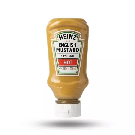 Enhanced A hand holds a bottle of Heinz English Mustard Hot against a white background. The 255g squeeze bottle features the red and green classic style label.