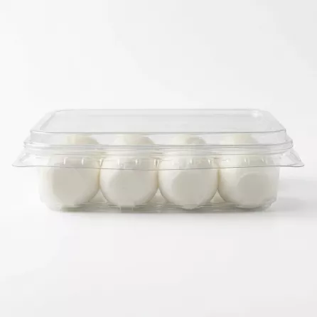 This is your transformed e-commerce product image and the requested SEO-friendly image alt-text. **ALT-TEXT**: A clean side-view photo of Melis Labneh Cheese Balls in a clear plastic container against a white background. It shows four smooth, white cheese balls arranged neatly inside.
