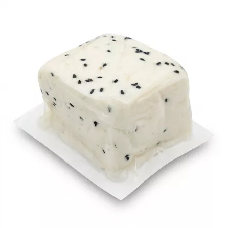 Enhanced Milky's Halum Nabulsi Cheese block with visible nigella seeds in clear packaging.