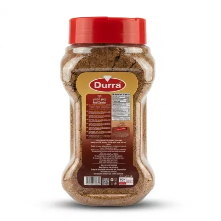 A professional e-commerce photograph showing the back of a 500g container of Durra Red Zaatar spice blend with its red cap. The detailed product label is clearly displayed, listing ingredients and instructions in multiple languages, including English and Arabic.