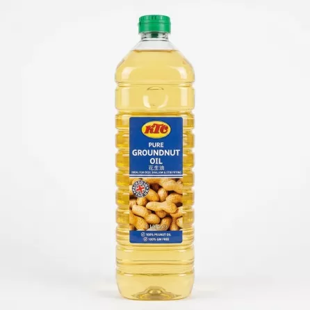 A 1-liter bottle of KTC Pure Groundnut Oil with a clean blue label featuring the red and yellow KTC logo, peanut illustrations, and '100% GM FREE' text. The bottle has a green cap, ribbed clear plastic, and contains golden groundnut oil, standing against a pure white background with soft, even shadowing.