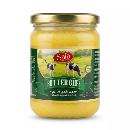 [Safa Butter Ghee - Halal Premium Quality Jar. A clear glass jar with a gold lid is filled with yellow ghee and features a green label with cows in a pasture. Text reads 'Safa BUTTER GHEE' and Arabic script for 'Premium Ghee'.]