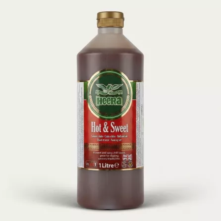 A 1-liter bottle of Heera Hot & Sweet Chilli Sauce is presented in a sharp, professional e-commerce product photo, centered with a clean background. The prominent front label details the product as Hot & Sweet Chilli Sauce in multiple languages and displays the Halal logo and Union Jack.