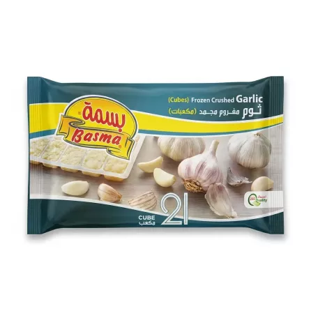 A 250g package of Basma Frozen Crushed Garlic Cubes is centered on a clean white background. The front of the bag features the Basma brand logo in yellow, Arabic and English text for "Frozen Crushed Garlic Cubes", illustrations of garlic bulbs and cubes, and a large number "21". The package is in sharp focus, free of labels, and cast a soft, symmetrical shadow.