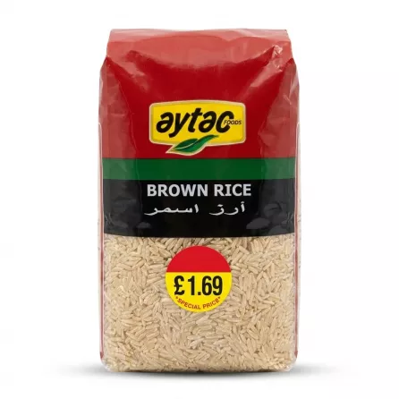 A 1kg pack of Aytac Foods Brown Rice, featuring its red, green, and black packaging with a special price sticker, centered in sharp focus on a clean white background.
