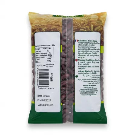 A 1:1 professional studio photo of the back of the 850g Sofra Red Kidney Beans bag. The product is centered, set against a pure white background with soft, symmetrical shadows on both sides. All background clutter and the hand holding the package have been removed, with surface imperfections cleaned up. All text and labels, including the nutritional info, storage details in French, English, and Arabic, ingredients, weight, barcode, distribution details, 'Best Before: End: 05/2027', and Lot No: 010424, are preserved with sharp focus. The package retains its original dark red beans, gold packaging, and white labels.