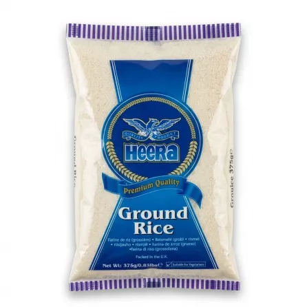 Enhanced Front of Heera Ground Rice 375g pack held in hand