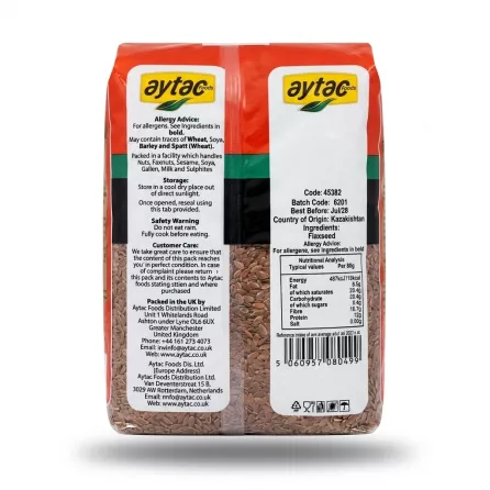 A professional e-commerce product photograph showing the back of an 800g bag of Aytac Whole Flaxseeds against a clean white background. The packaging features clear English text detailing allergy advice, storage instructions, ingredients, nutrition facts, and contact information, with a large window showing the natural brown flaxseeds.