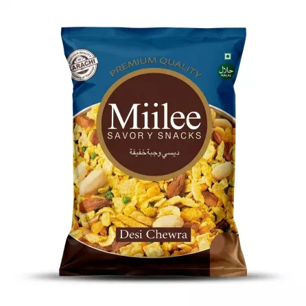 A 1:1 professional e-commerce product photograph features a centered pack of Miilee Desi Chewra Savoury Snacks 85g, with all external tags removed. The dark blue and brown bag displays the clear Arabic script, the prominent 'Miilee' brand name, 'Desi Chewra', 'KARACHI Quality', and a visible "Halal" logo, all in sharp focus against a plain white background. The pack includes an illustration of the chewra snack mix, filled with rice flakes, lentils, peanuts, and other savory ingredients.