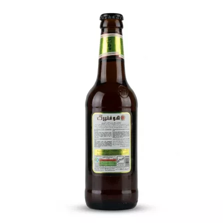 A 1:1 professional e-commerce product photograph features the rear label of a 330ml Hoffenberg Malt Drink - Halal & Lemon Flavour. The dark glass bottle is centered on a clean white background, showcasing all factual details, text, ingredients, and nutrition facts with sharp focus under soft studio lighting and an even shadow.