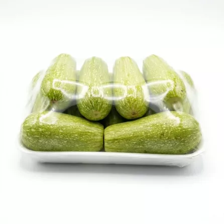 Enhanced Side view of Lebanese green courgettes in sealed packaging