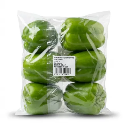A professional 1:1 e-commerce product photograph showing a pack of Nestlofft fresh green peppers in clear plastic packaging, featuring a prominent rear label with details like weight (400g) and origin.
