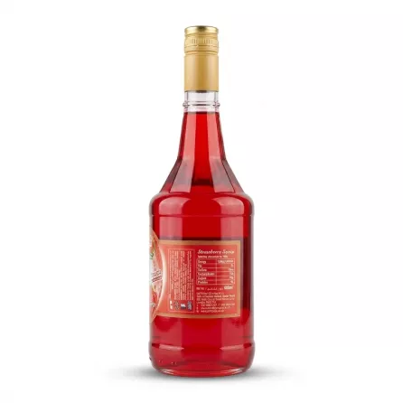 Enhanced Side view showing contents and red liquid of Al Dayaa Strawberry Syrup