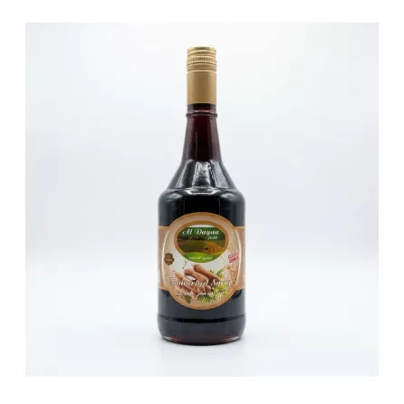 Enhanced Front view of Al Dayaa Tamarind Syrup 600ml bottle held in hand