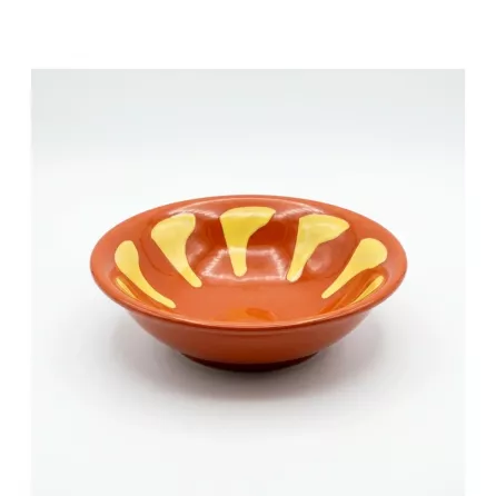 Enhanced Phoenix 5 inch Arab Bowl with orange and yellow hand-painted design on countertop