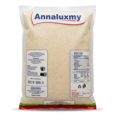 A 1:1 professional e-commerce product photograph showing the back of an Annaluxmy Andhra Sona Masoori Rice 10kg transparent bag, isolated on a white background. The bag displays the rice grains, cooking instructions, detailed nutritional facts, and manufacturer information under sharp, soft studio lighting.