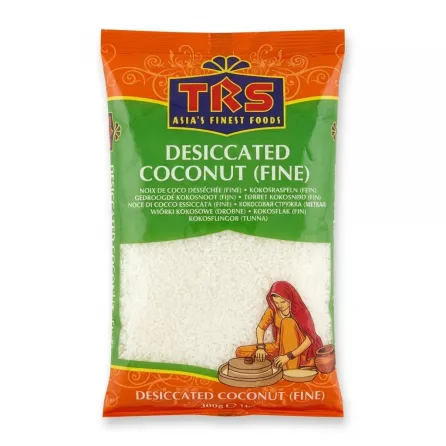 A 300g packet of TRS Desiccated Coconut Fine, featuring the TRS brand logo and an illustration of an Indian woman on an orange and green package. The clean, professional photo is centered against a pure white background.