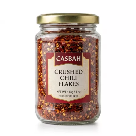 Side view of Casbah Crushed Chili Flakes glass jar showing chili flakes