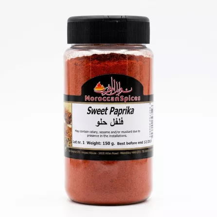 Hand holding a jar labelled Moroccan Spices Sweet Paprika 150g with a clear black lid