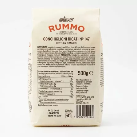 A 1:1 professional studio photograph displaying the detailed rear label of a Rummo Conchiglioni Rigati No.147 pasta package, showcasing nutritional information, ingredients, and storage instructions against a clean white background.