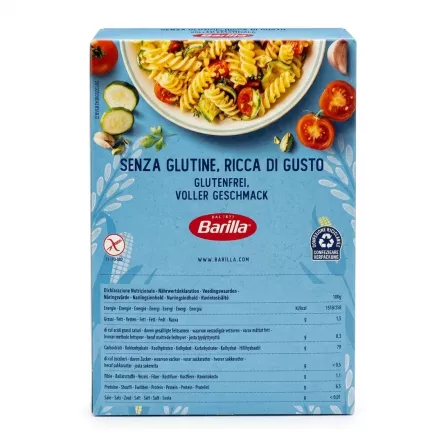 A professional studio photograph of the back of a Barilla Gluten Free Fusilli Pasta box, showing the serving suggestion illustration of pasta salad, multi-language product claims ("SENZA GLUTINE," "GLUTENFREI"), the Barilla logo, and a detailed nutritional information table.