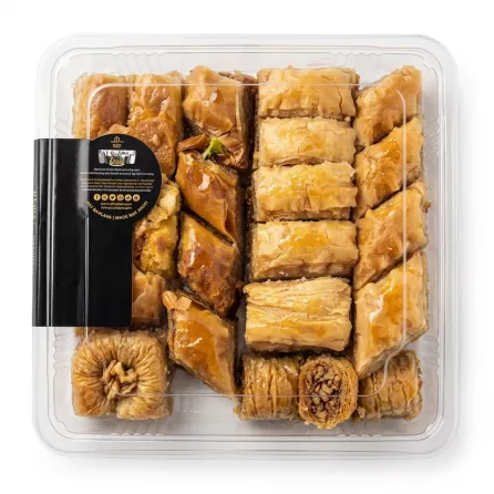 Close-up of flaky baklava pieces in Al Sultan mixed baklava selection tray with price label