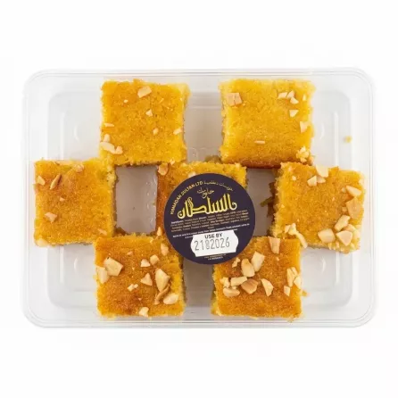 Pack of Sultan Basbousa semolina cake slices with nuts, sealed in a plastic container