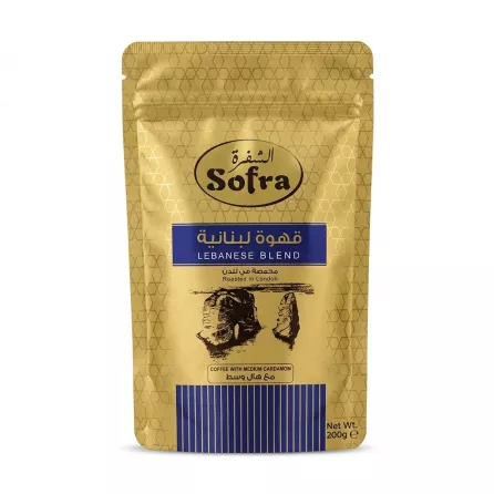 A 200g gold-foil stand-up pouch of Sofra Lebanese Blend Coffee with Medium Cardamom. The pack features Arabic text, a landscape illustration, and states "Roasted in London".