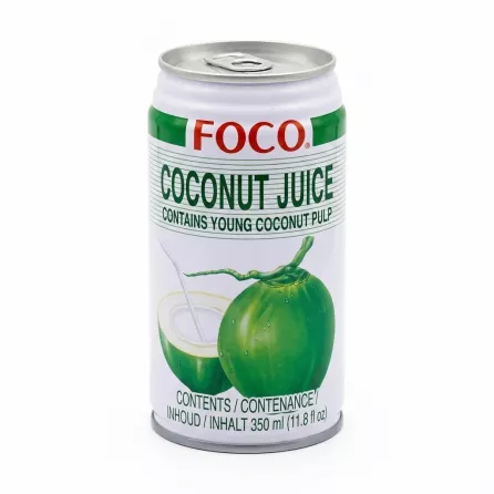 Hand holding a can of FOCO Coconut Juice Drink 350ml with green coconut graphic
