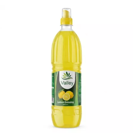 Front view of Valley Lemon Dressing 1000g bottle in hand
