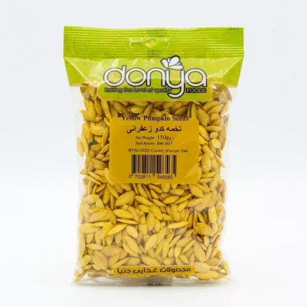 Front view of Donya Yellow Pumpkin Seeds 150g pack held in hand, showing branding and product details