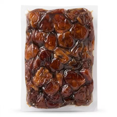 Back view of Al Barakah Sukkary Premium Dates 1kg pack showing glossy dates inside the vacuum-sealed bag