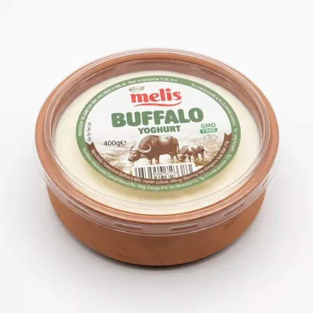 Hand holding Melis Buffalo Yoghurt 400g container in a shop aisle